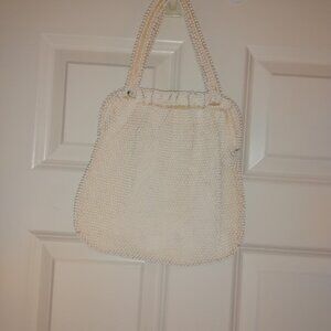 Corde': Cream color beaded bag spacious with inner compartment.